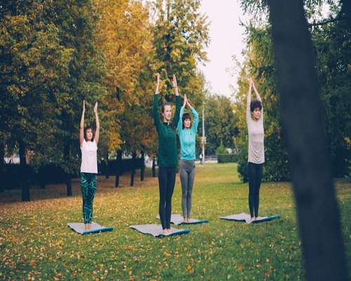 Woman practicing yoga outdoors in nature